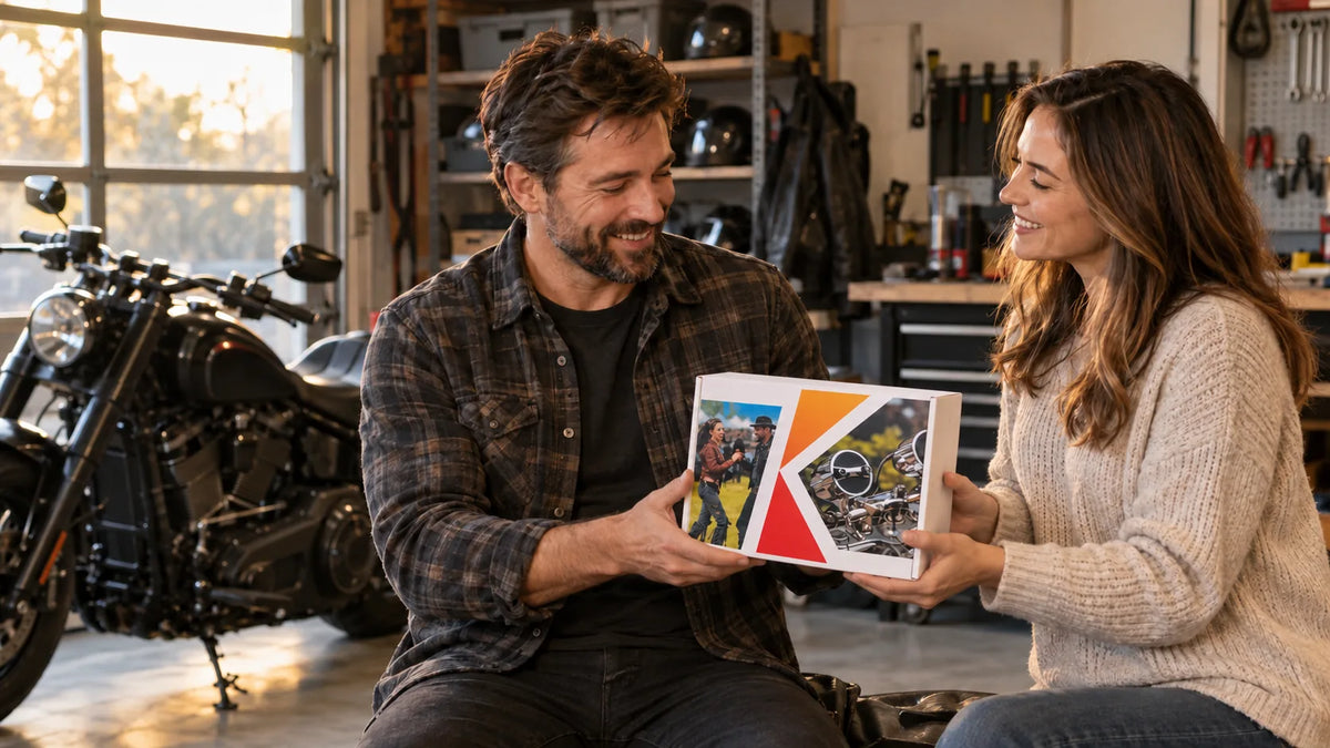 A couple shares a KSPEAKER S7 gift box beside a motorcycle in a garage; conceptual lifestyle image, not a documented customer photo.