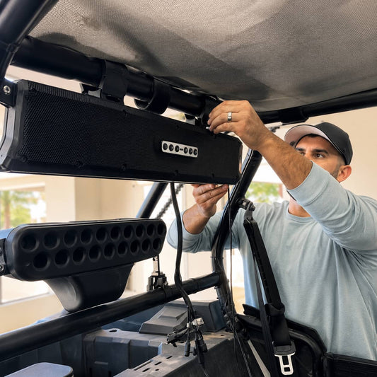 Installing a UTV soundbar on a roll cage under the roof