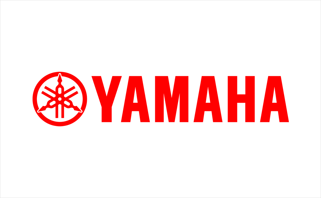 A bright red Yamaha logo featuring the iconic three intersecting tuning forks enclosed within a circle, followed by the word "YAMAHA" in bold, uppercase red letters on a white background.