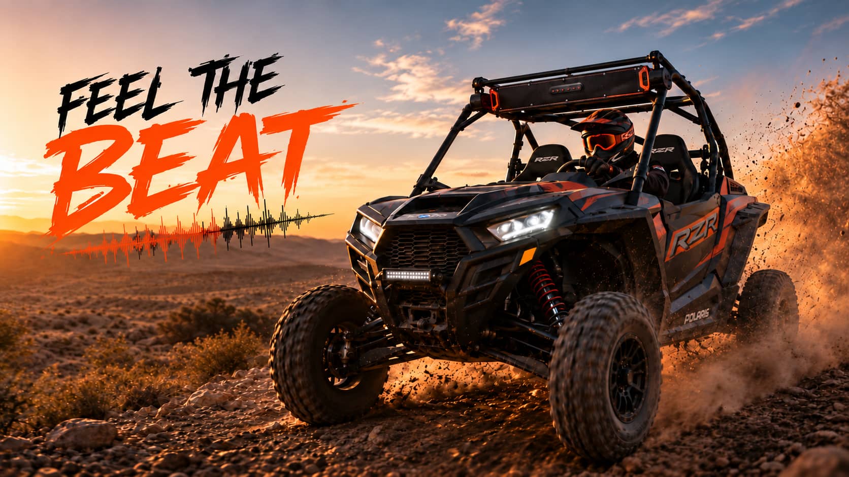 Polaris RZR UTV driving through the desert at sunset with a roof-mounted K-SPEAKER soundbar.