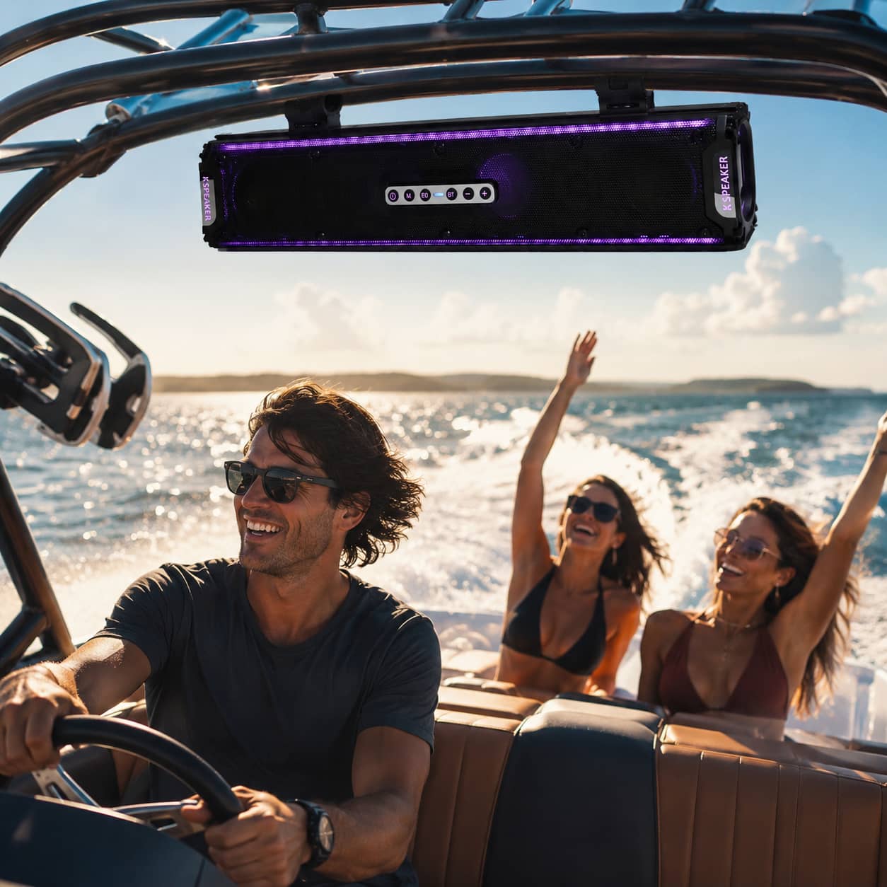 Marketing photo of a waterproof marine soundbar with purple lights mounted on a speedboat wakeboard tower during an ocean cruise. Highlighting the corrosion-resistant audio system engineered for luxury yachts.