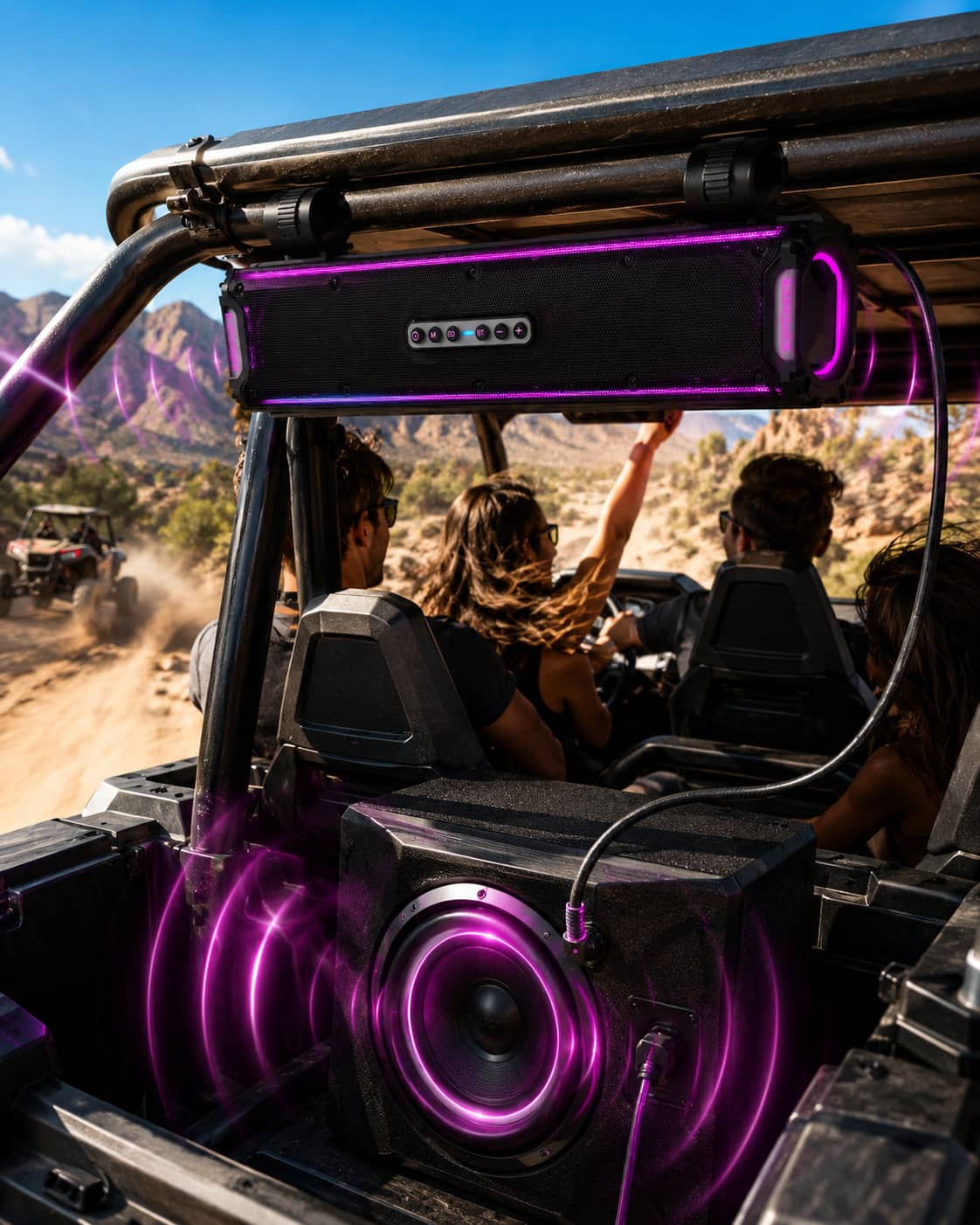Marketing photo of a waterproof UTV soundbar connected to an external subwoofer via audio cable during a desert ride. Highlighting the expandable heavy bass audio system engineered for off-road vehicles.