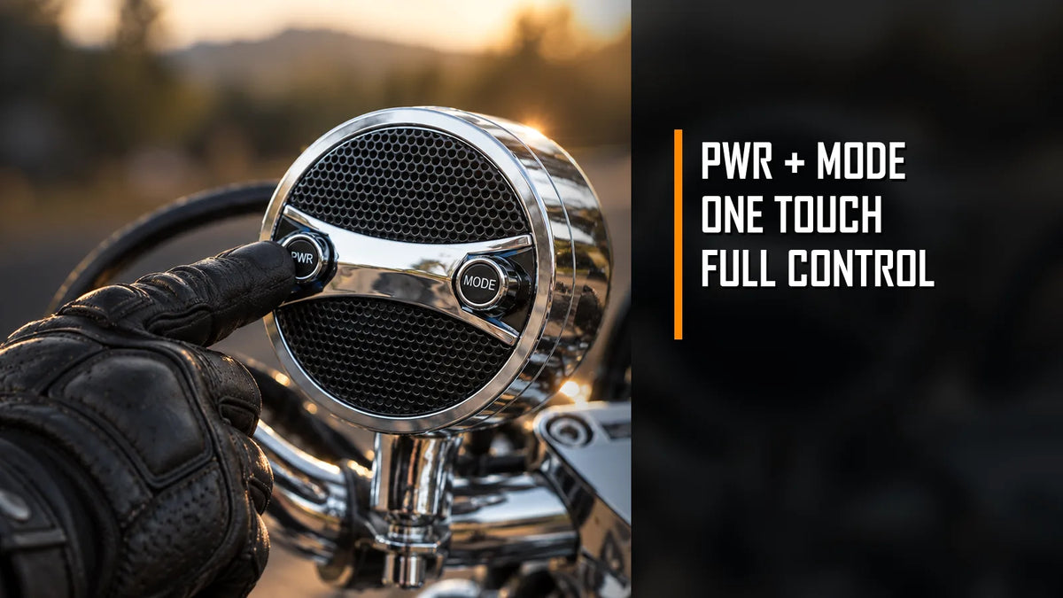 Gloved rider hand pressing the PWR button on a KSPEAKER S7 motorcycle speaker, with MODE control visible for one-touch operation.