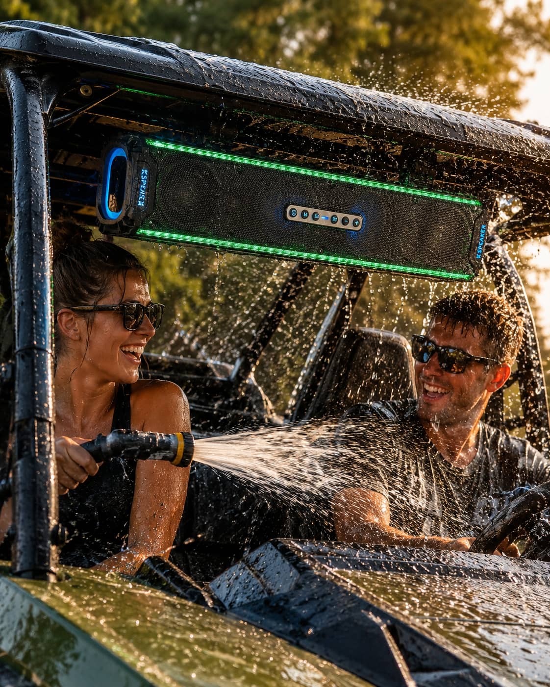 A man power-washing a black UTV soundbar, demonstrating its ultimate marine-grade waterproof construction. Proven weatherproof and dustproof audio system designed to withstand harsh outdoor environments for off-road side-by-side vehicles.